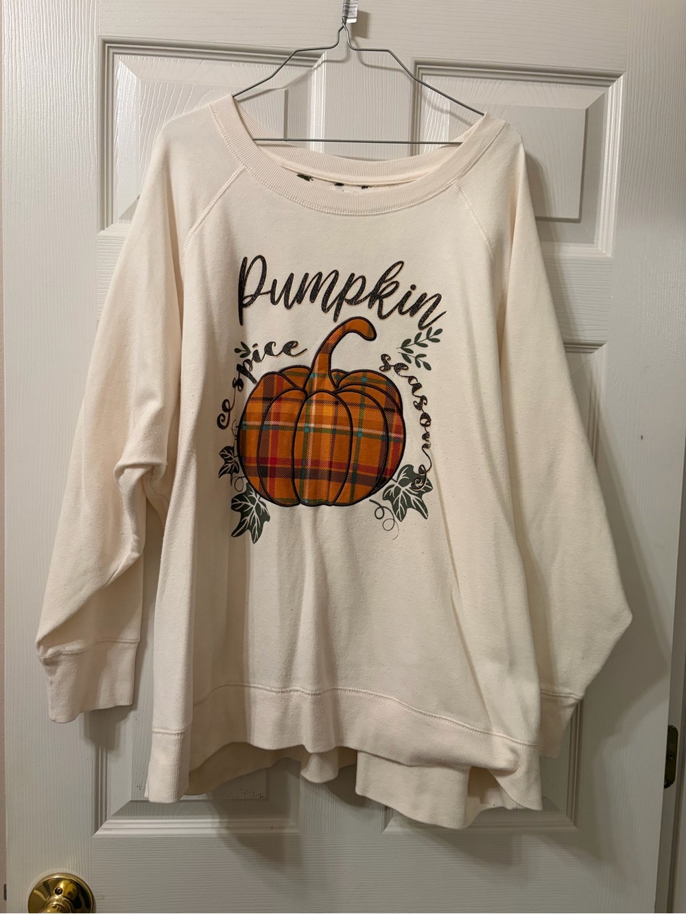 Maurices Cream Sweatshirt with Orange Plaid Pumpkin Graphic with the words.